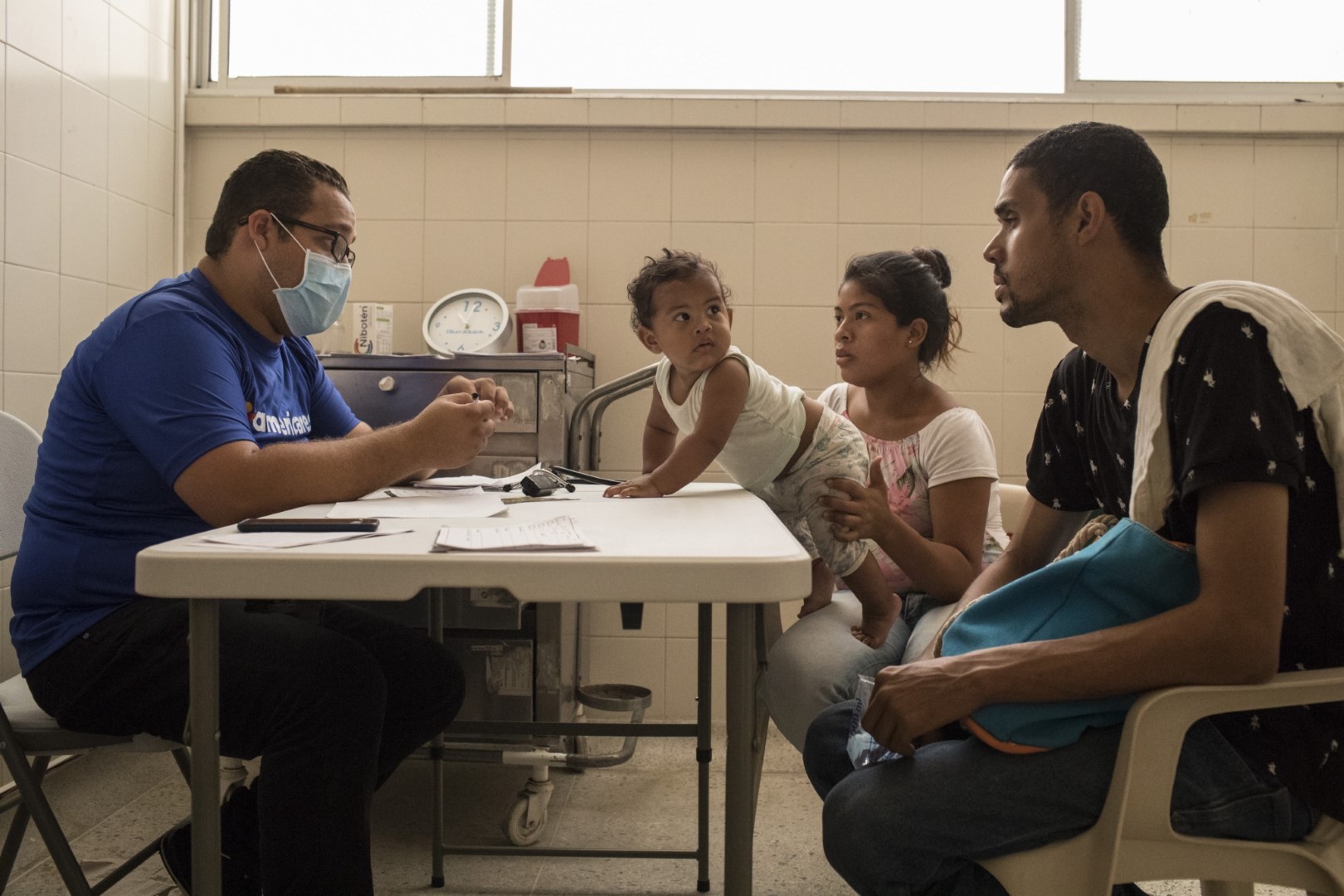 A Venezuelan family seeks care at an Americares primary care center in Colombia. Photo by Nicolo Filippo Rosso.