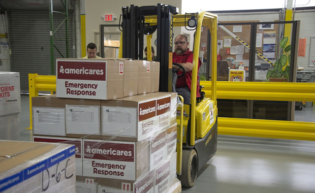 Americares employees prepare emergency supplies in the organization’s Connecticut distribution center on Sept. 10, 2018, as Hurricane Florence intensifies. Photo courtesy of Americares. 