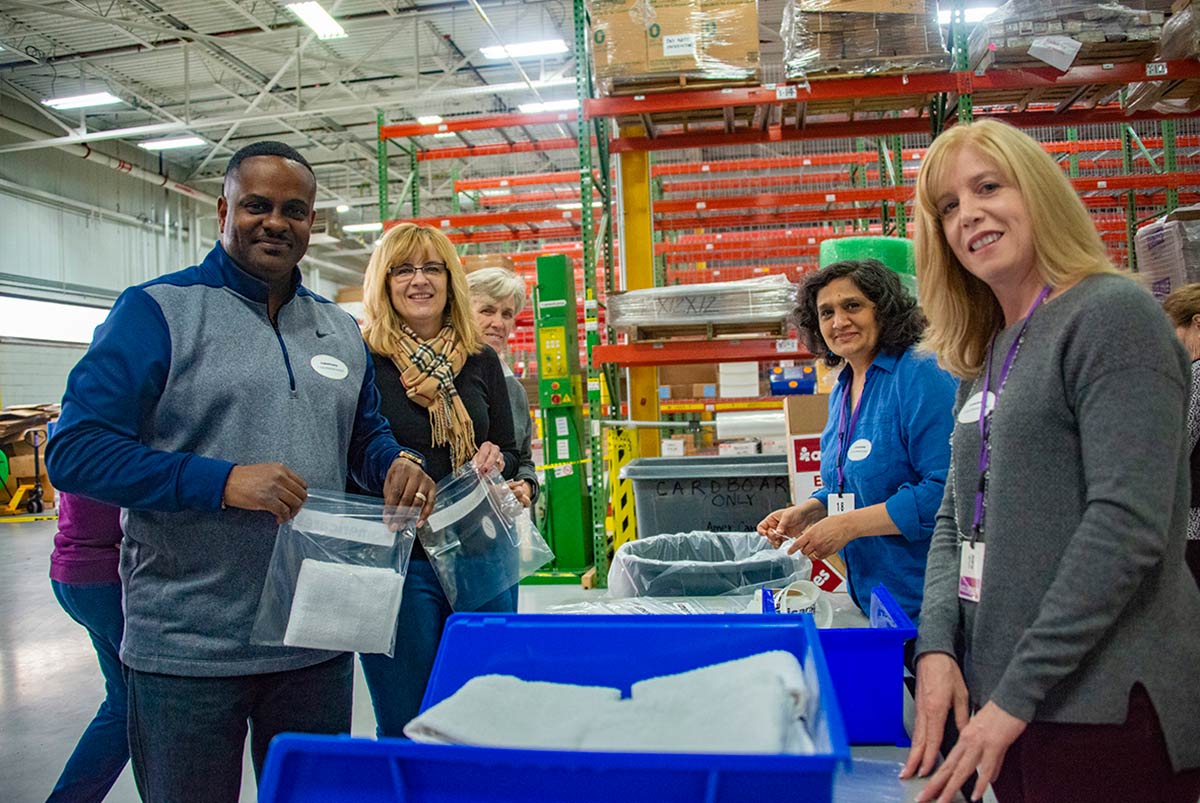 From left to right: Joe Poindexter and Suzanne Dicintio of Nestlé Waters North America, Cathy Manion of New Canaan, Sonal Vora of Stamford, and Lori Brello of Nestlé Waters North America pack hygiene kits for disaster survivors on Giving Tuesday. 