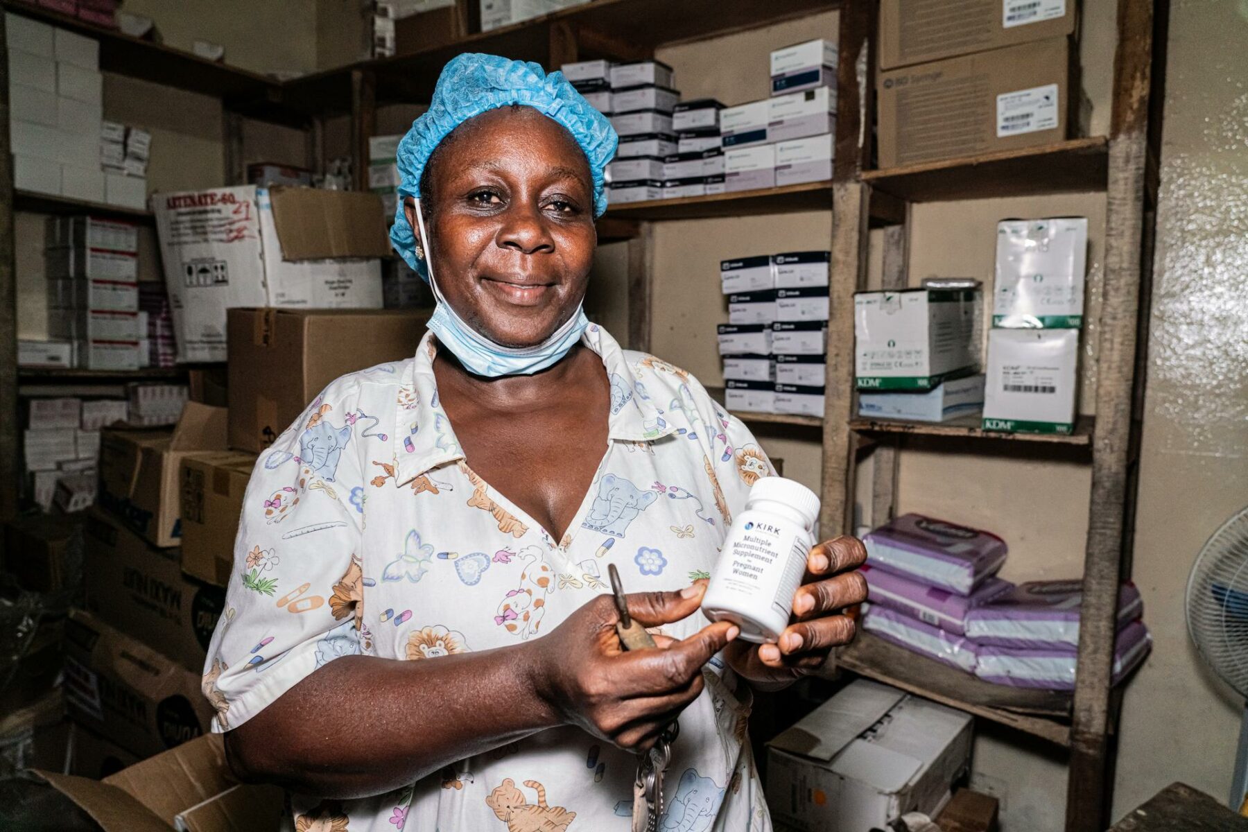 Monrovia Doe of Liberia shows a bottle of medicine.