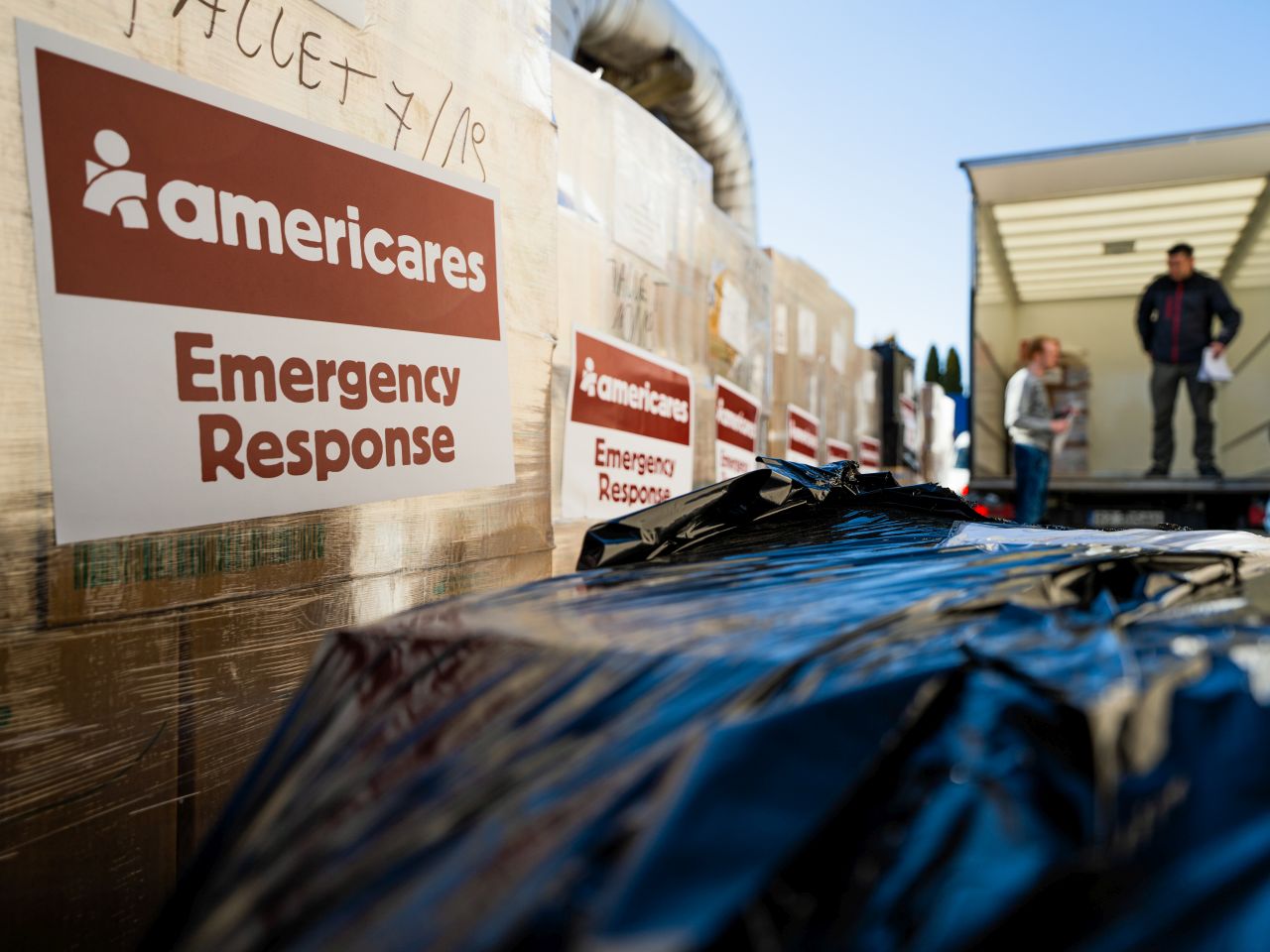 A team loading emergency shipment at the border