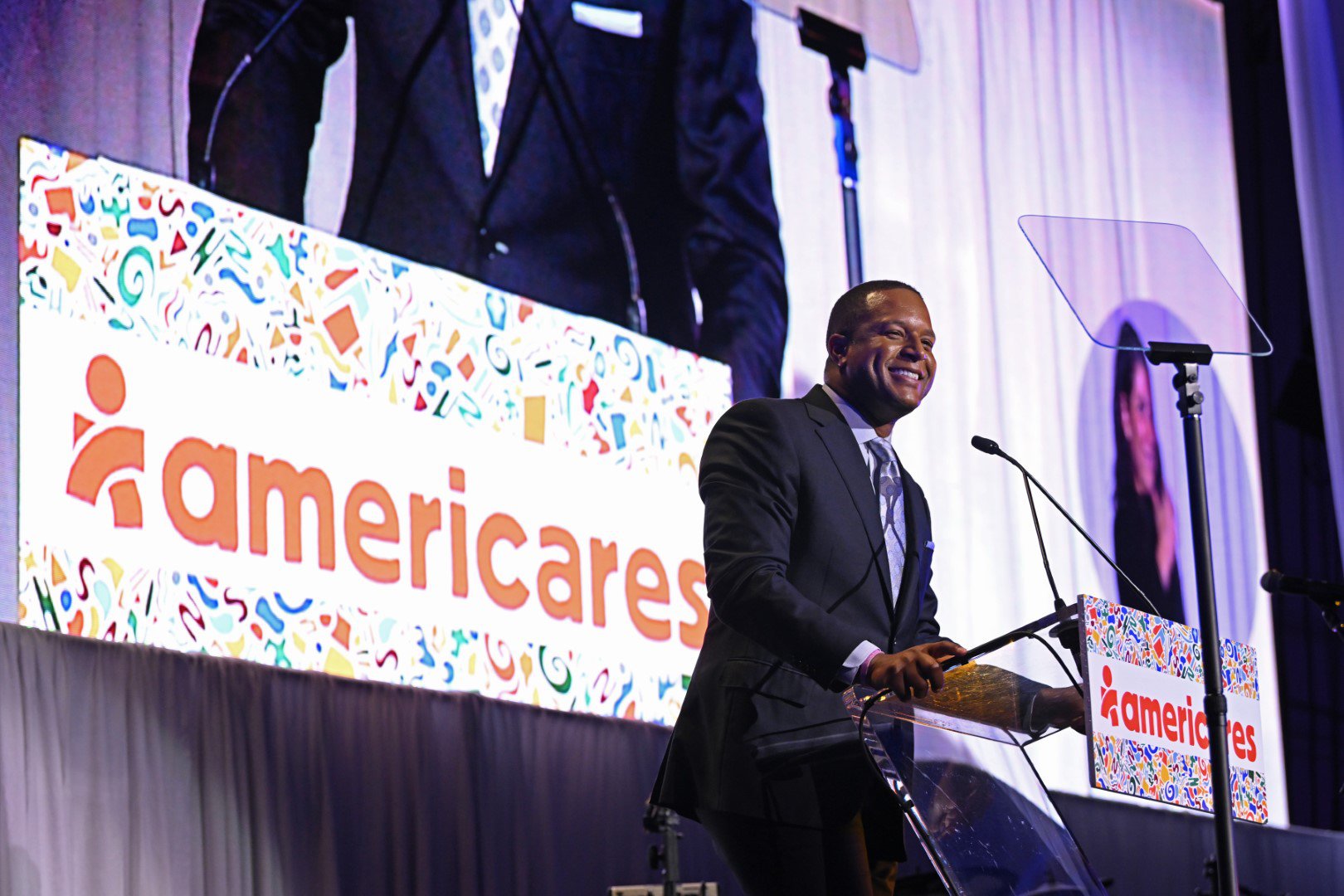 News Anchor, NBC News’ “TODAY” and Co-Host, “3rd Hour of TODAY” and Master of Ceremonies Craig Melvin speaks onstage at the 2022 Americares Airlift Benefit at Westchester County Airport on October 1, 2022. Photo by Bryan Bedder/Getty Images for Americares.