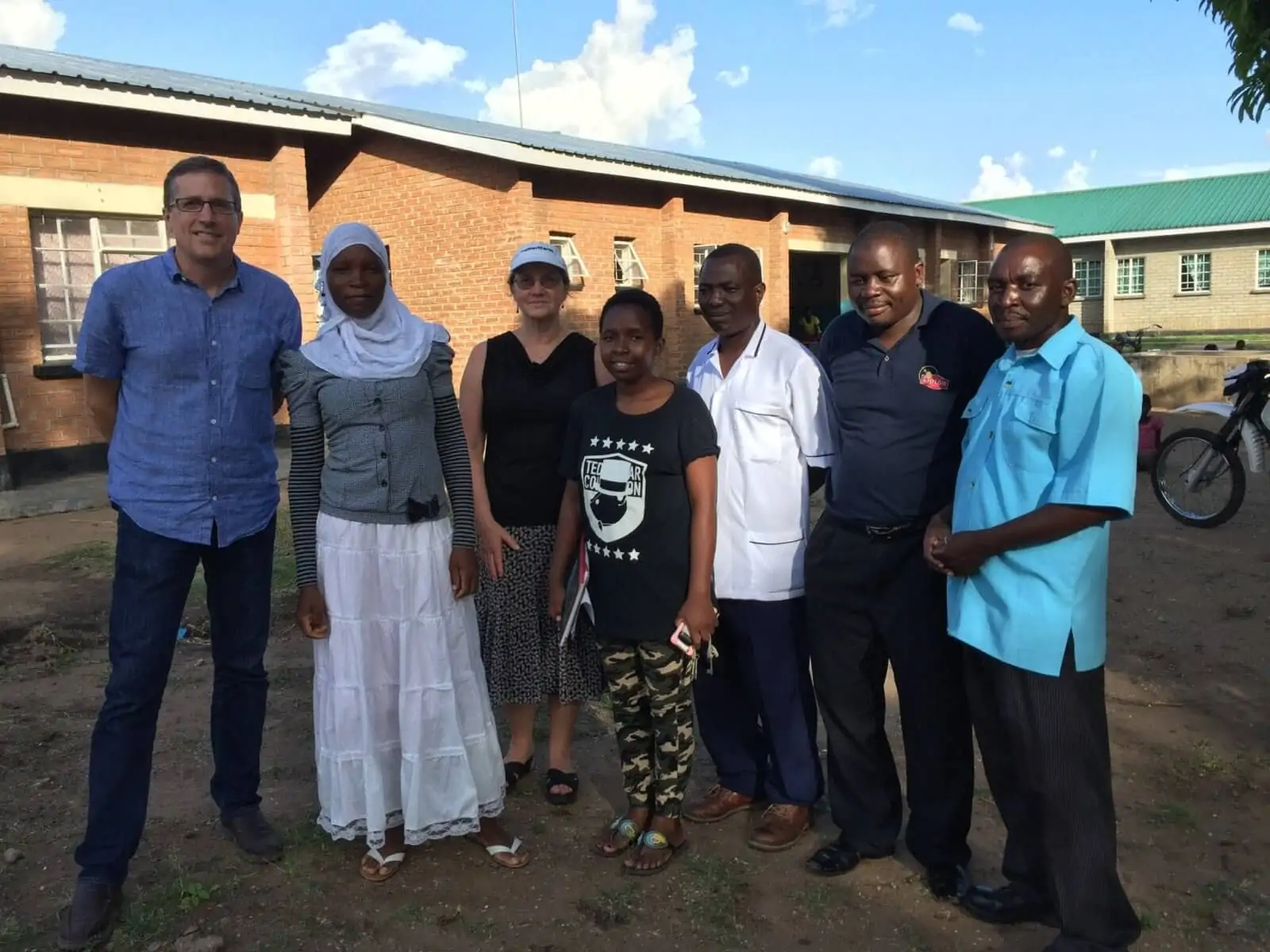 Michael Nyenhuis and Dr. E. Anne Peterson of Americares with staff from the Malombe health center in Malombe, Malawi.
