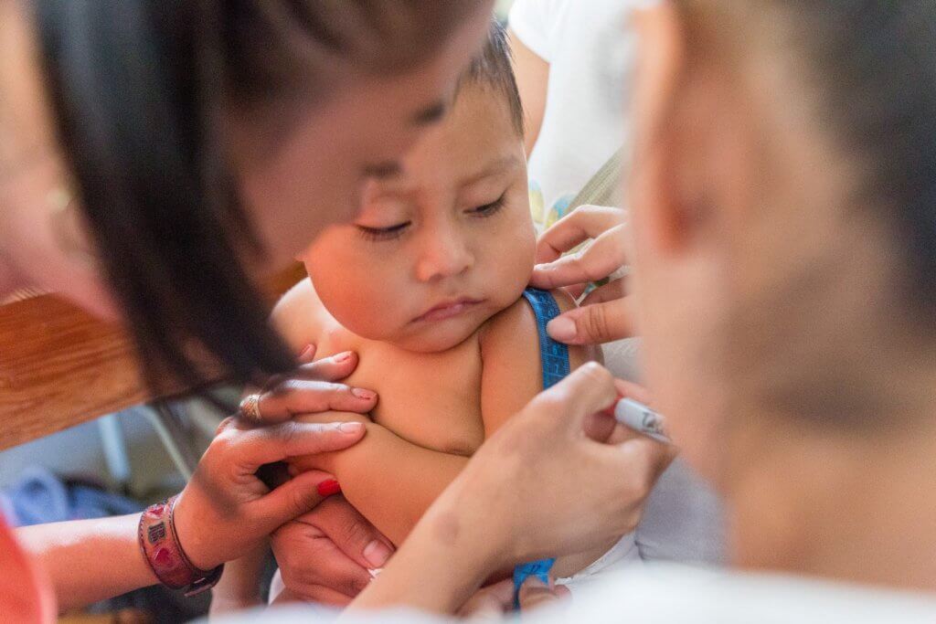 In Guatemala, where drought put children at risk of malnutrition, a child is measured to make certain he’s growing and thriving. An Americares program in the region aims to prevent malnutrition. Photo by William Vazquez