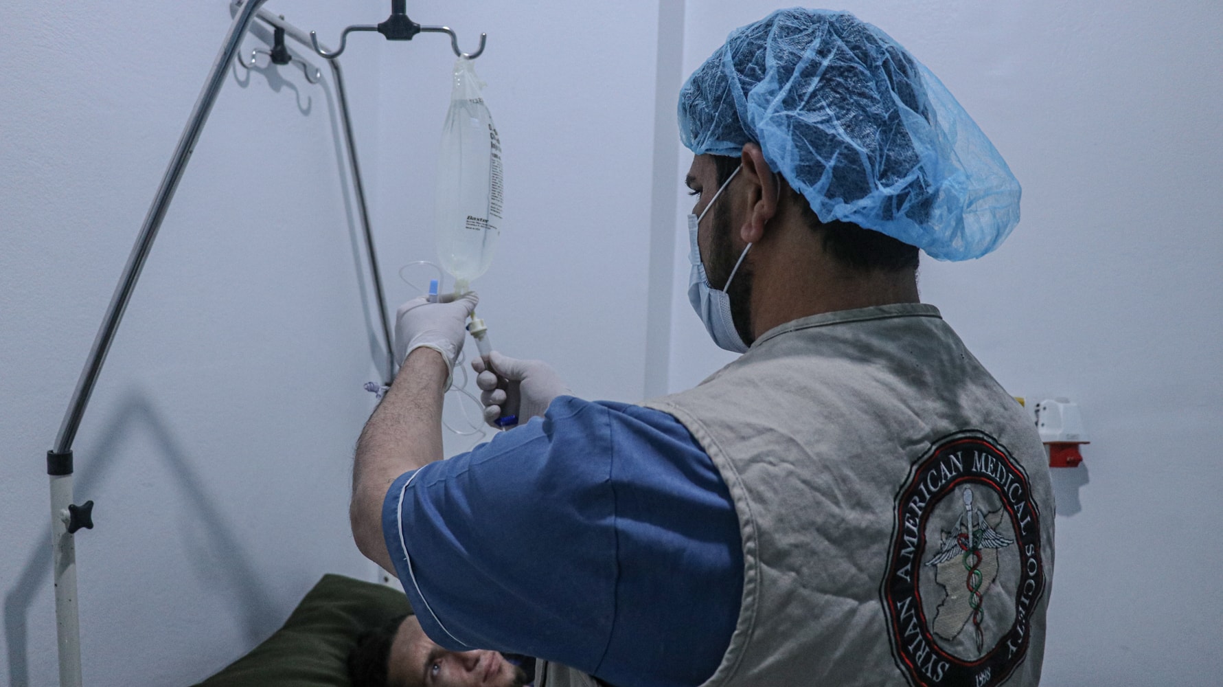 Syrian doctor treats patient laying down.