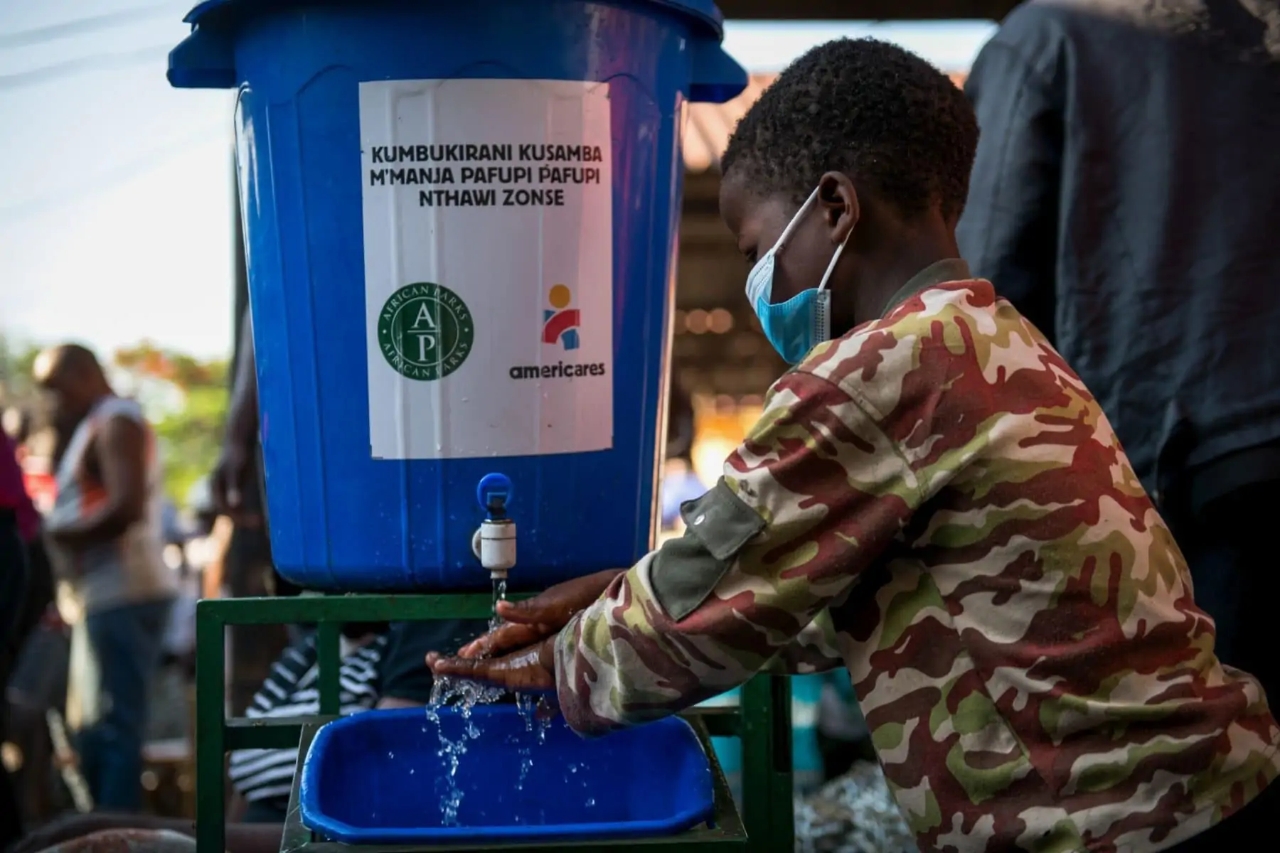 Child washing his hands. Photo by Thoko Chikondi