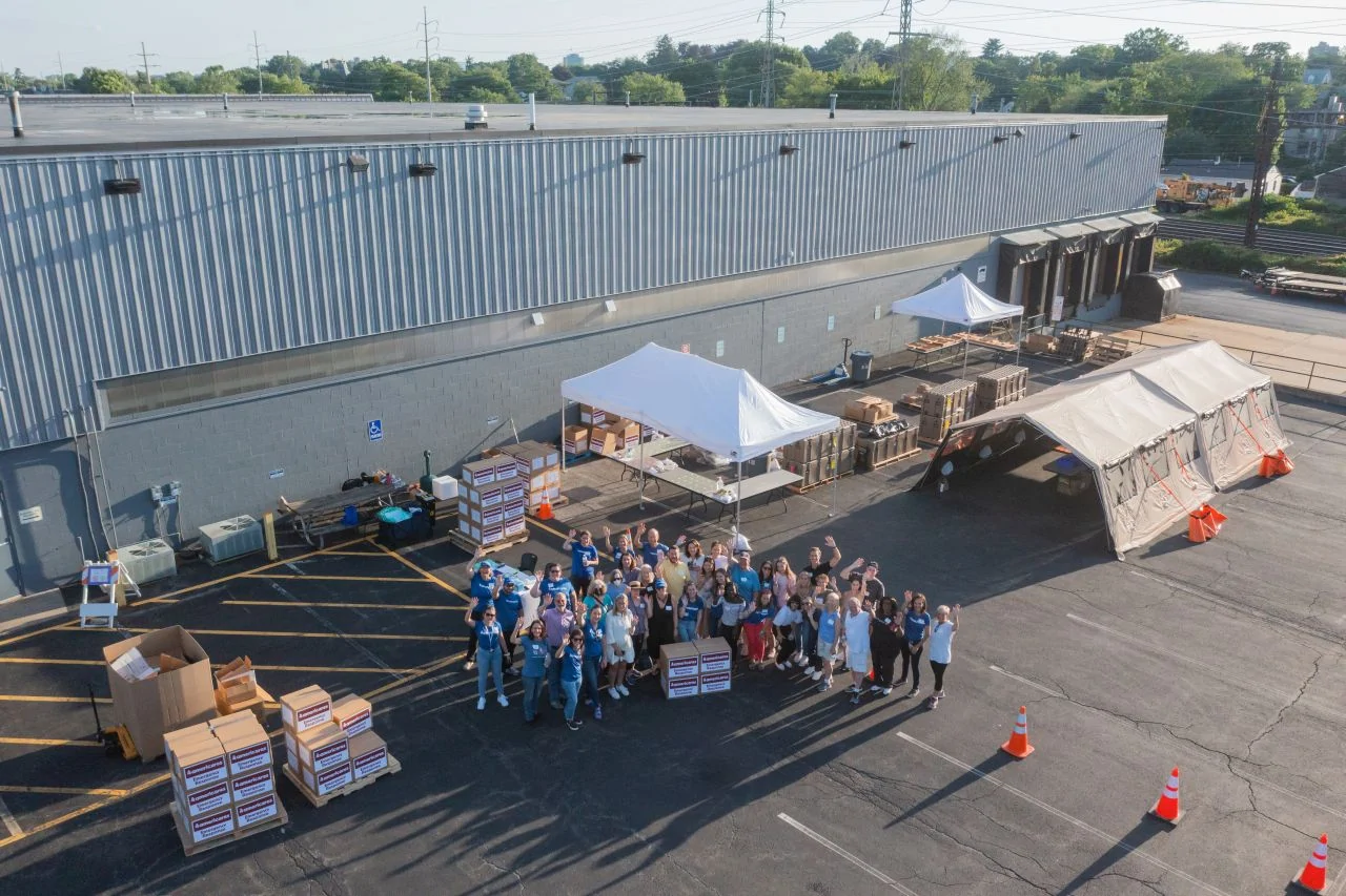 drone view of volunteer event with tents outside distribution center