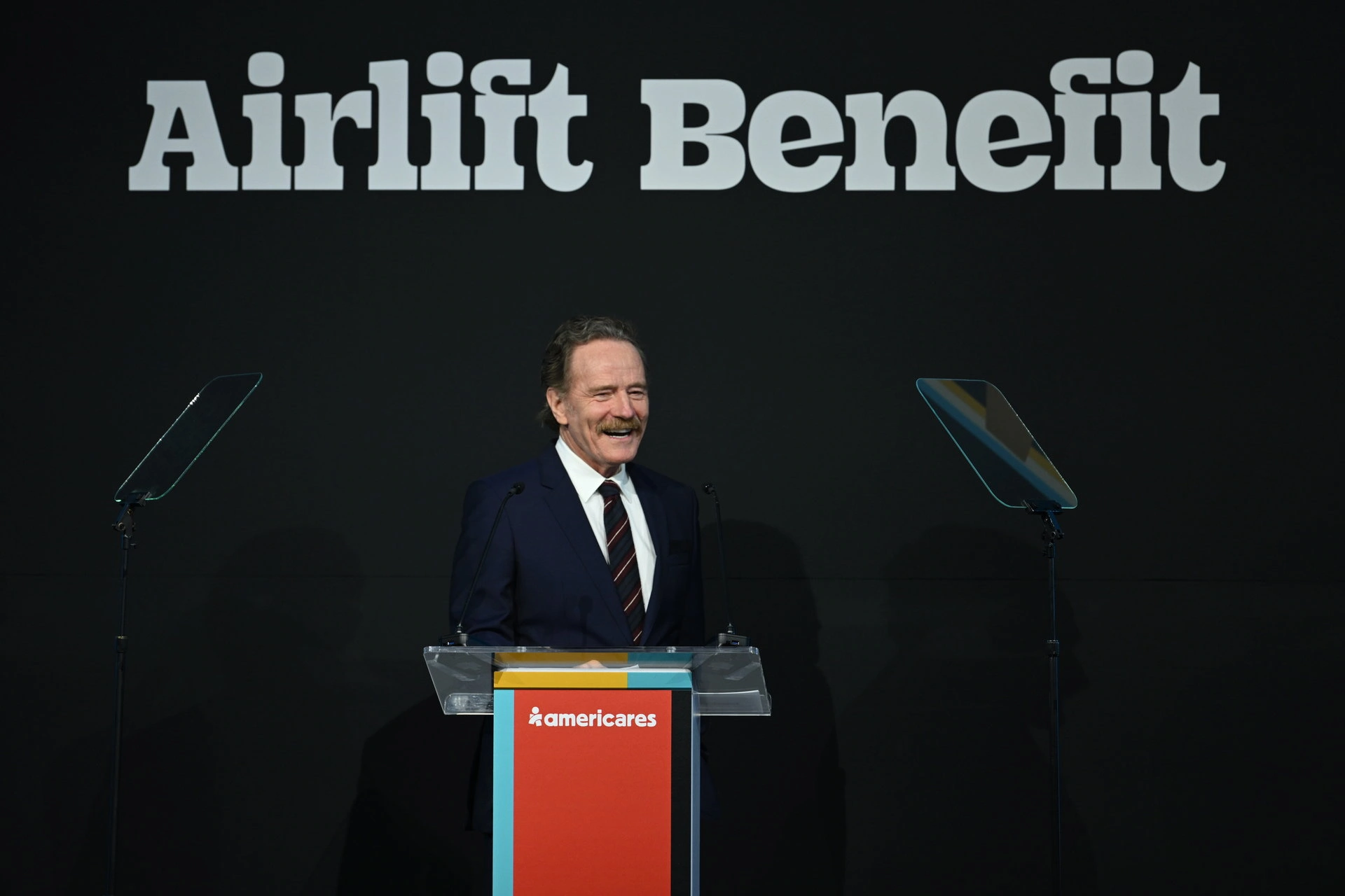 Master of Ceremonies Bryan Cranston on stage at the 2024 Americares Airlift Benefit. Photo by Bryan Bedder/Getty Images for Americares.