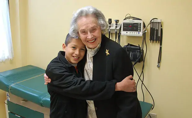 Leila at a recent Clinic visit with a patient