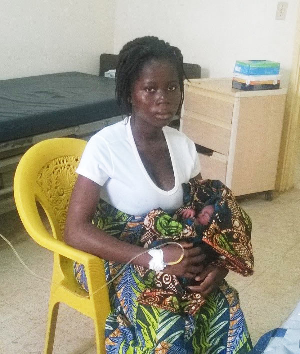 Americares works to engage key community members, including traditional midwives, to encourage them to refer pregnant women for care at health facilities. Mataline, pictured above, was referred to the hospital in Grand Bassa County by a traditional midwife, where she gave birth and received supportive care from trained health workers. *
