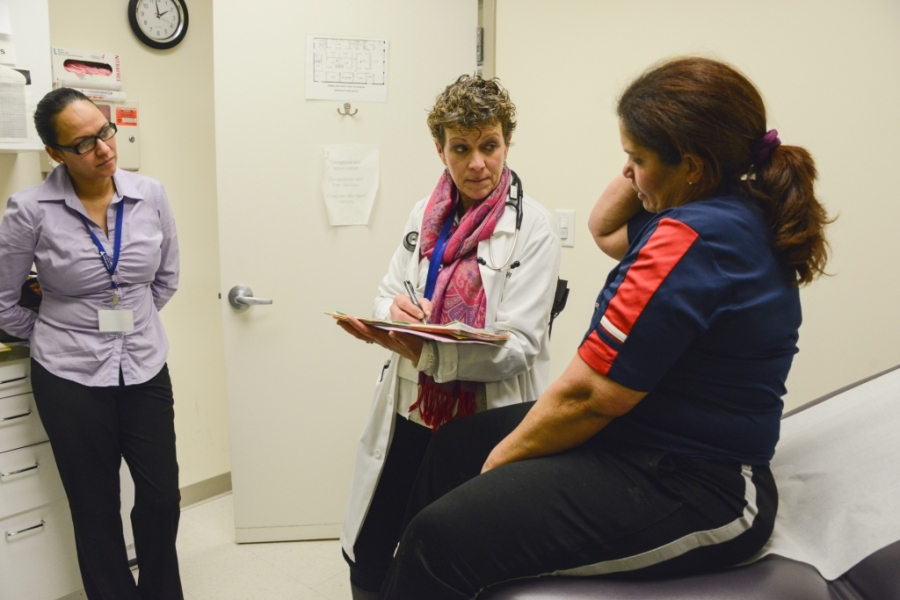 Health Coach Juanita Castillo, (left) a certified diabetes educator, participates in a medical visit for a patient of the Boehringer Ingelheim Americares Free Clinic in Danbury, Conn. Photo by Alex Ostasiewicz/Americares.