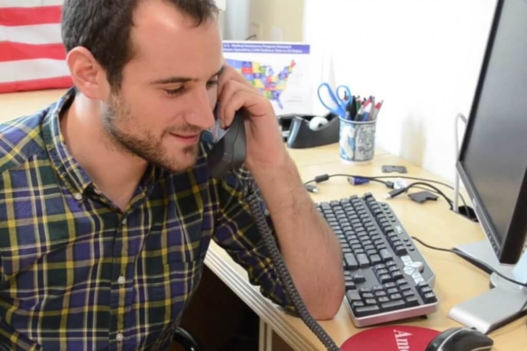 Employee talking with a donor via phone call.